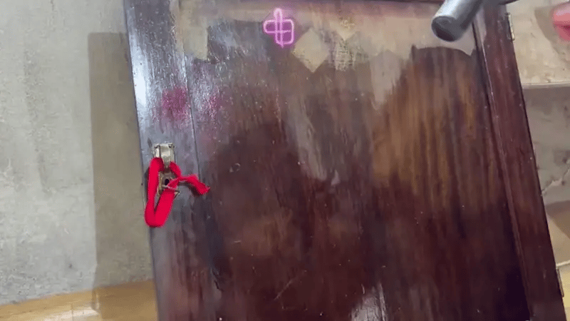 Laser cleaning tool removing varnish and surface residue from a wooden panel, restoring natural wood texture with low-heat precision.