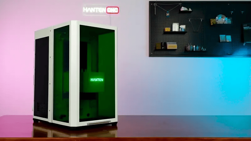 HANTEN Robin UV Ultra laser machine with safety lift-door enclosure providing full access and protection from UV exposure.