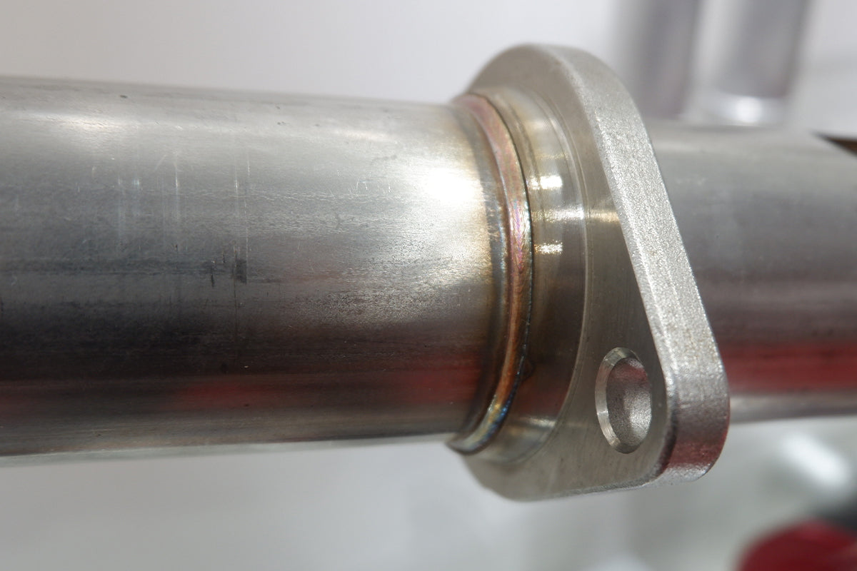 Stainless steel pipe joint with smooth laser-welded seam for high-strength industrial assembly.